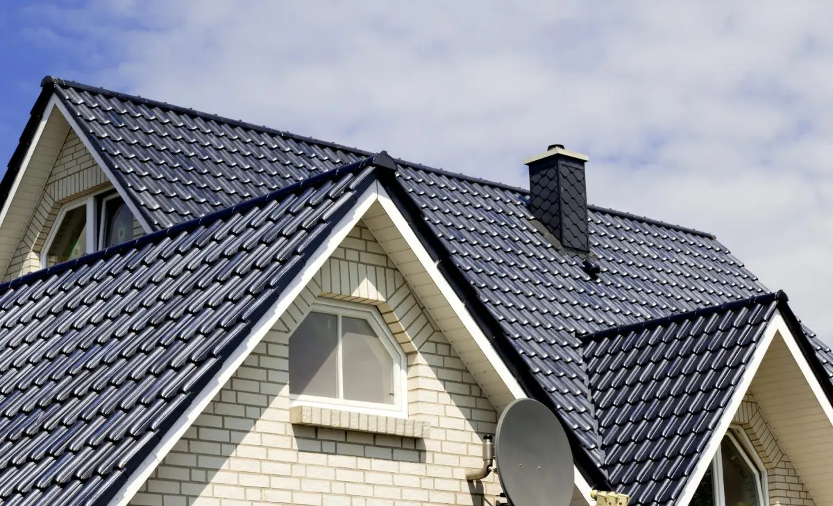 House with dark blue tiled roof.
