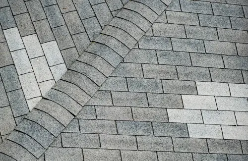 Gray brick pattern with diagonal arrangement.